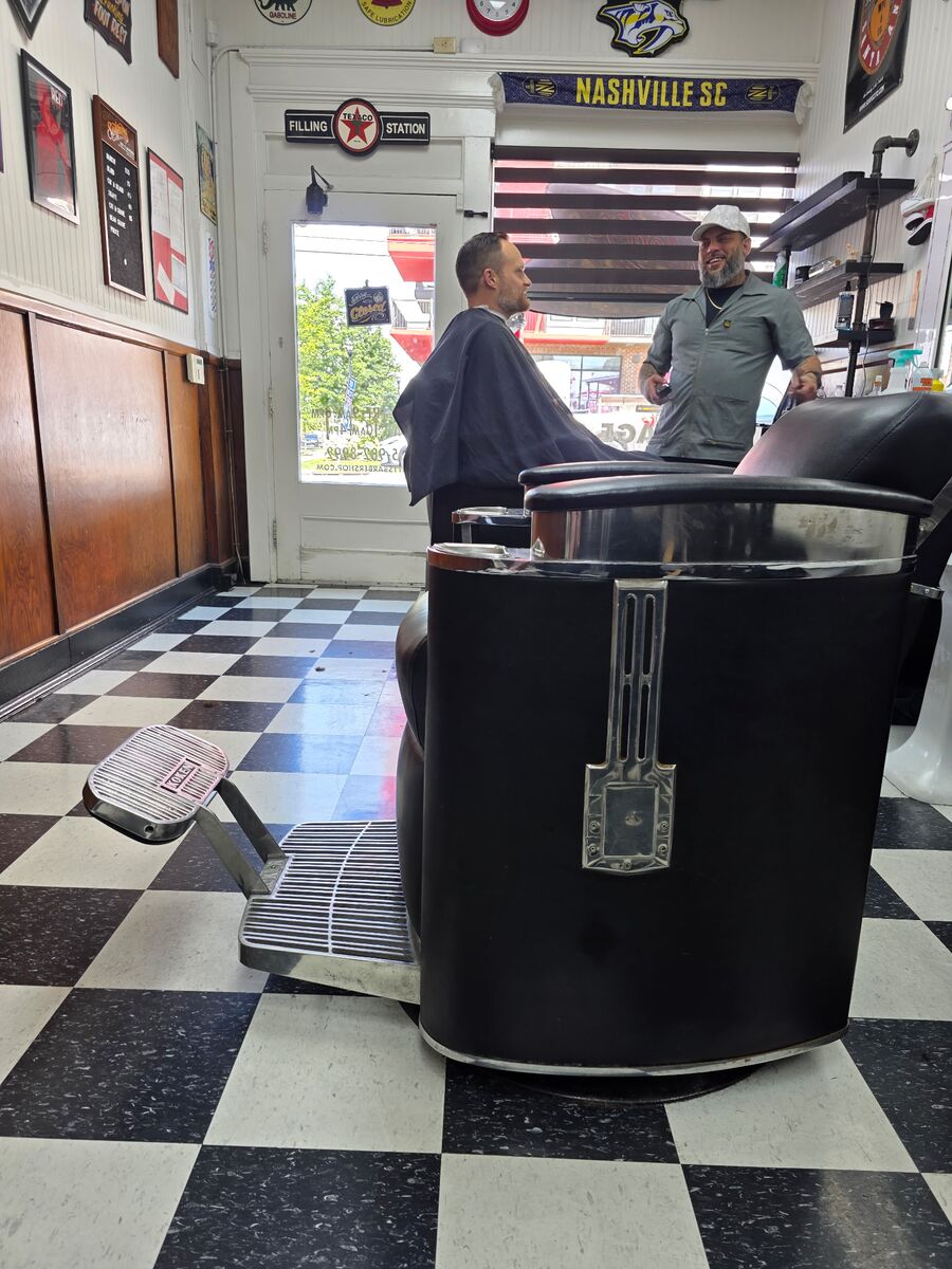 A client in the barber chair at Monty's Barber Shop